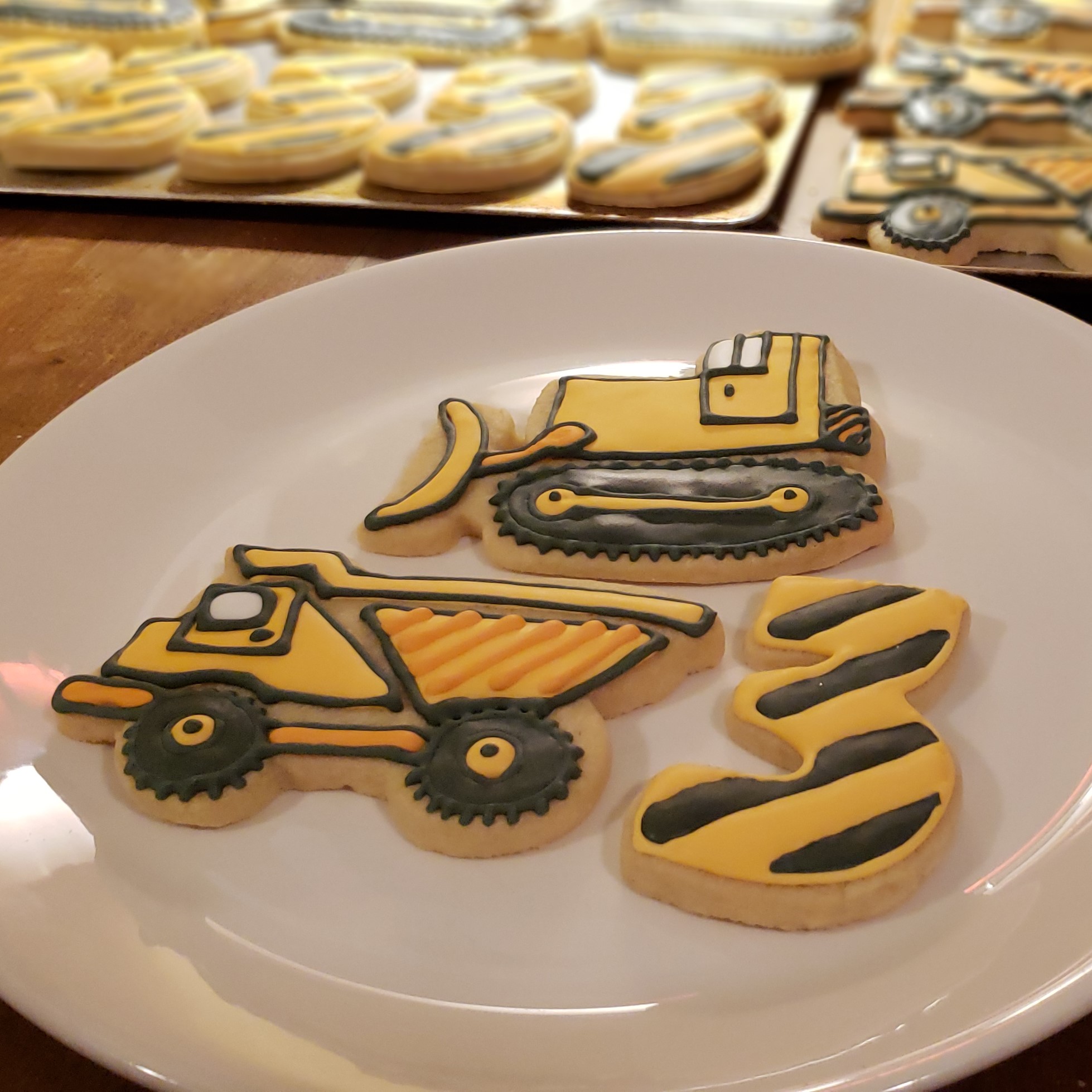 Dump truck, front loader, and number three sugar cookies