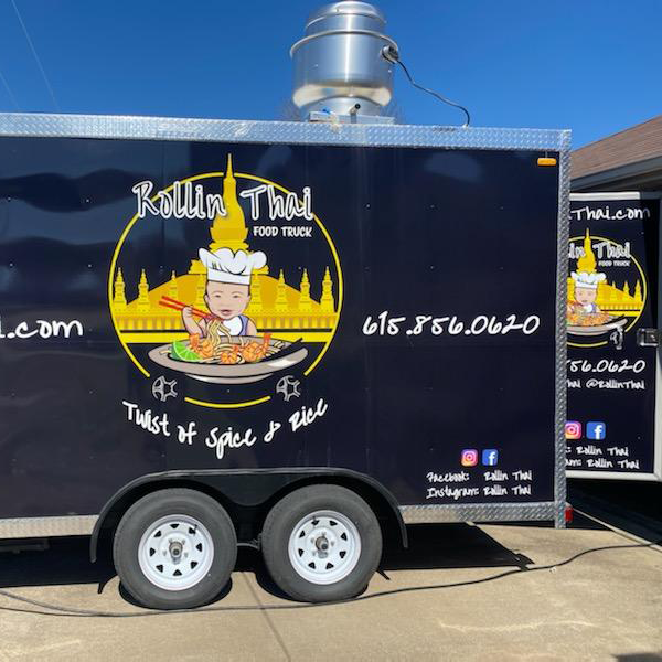 Rollin Thai logo on the side and back of truck door